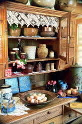 2013 Spring Open House, kitchen cupboard display with platter and other pieces.